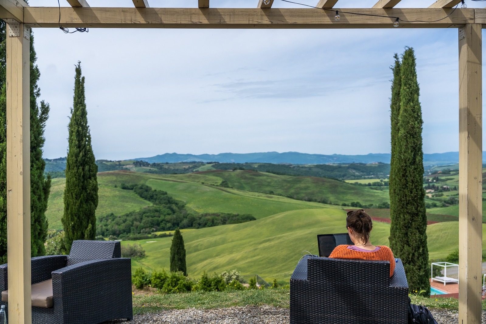 Working from the terrace overlooking Tuscan hills